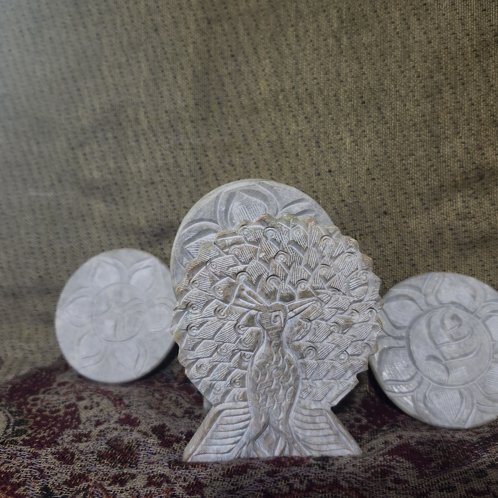 Elegant Carved Stone Peacock Art